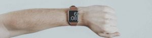 What is the best time to post on social media hand with watch image