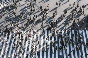 Build a long tail driving traffic people walking on a street image